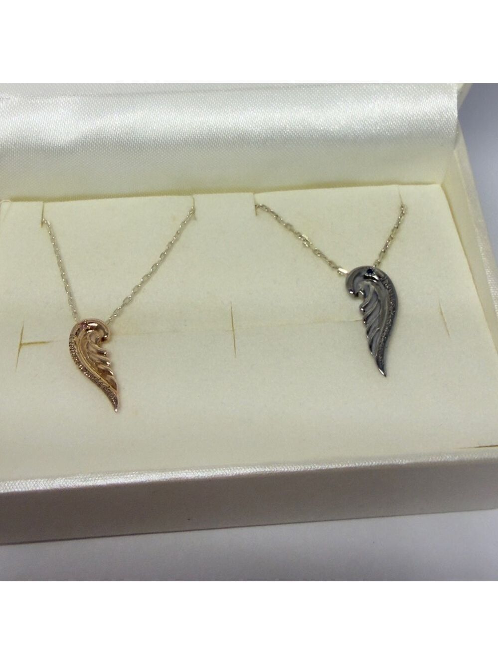 The kiss Japan brand Couple Gold tone and gunmetal Silver Wing Pendant Necklace